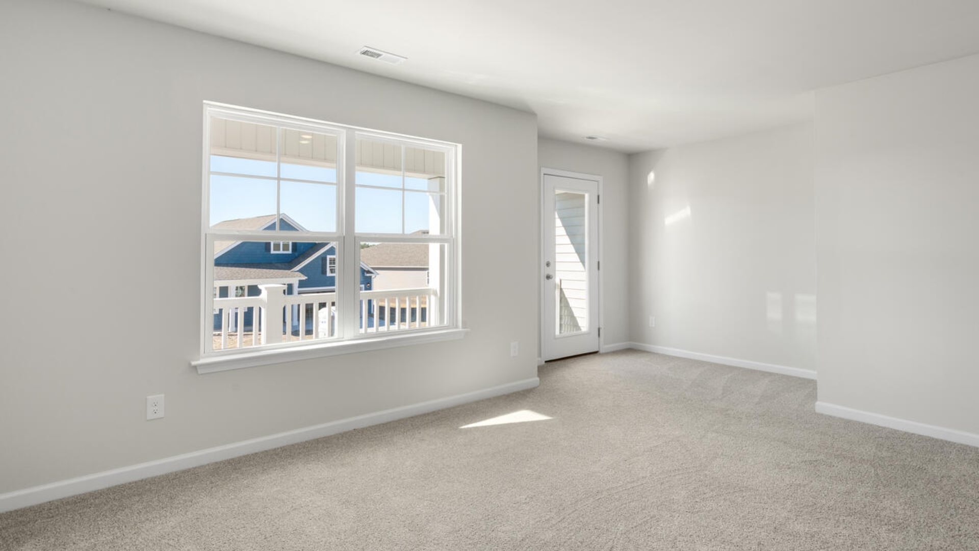 The Tillman floorplan features a first-floor primary suite, formal dining room, a large open living space divided by a kitchen island, and powder room on the first floor. Upstairs you are greeted by an convenient lof