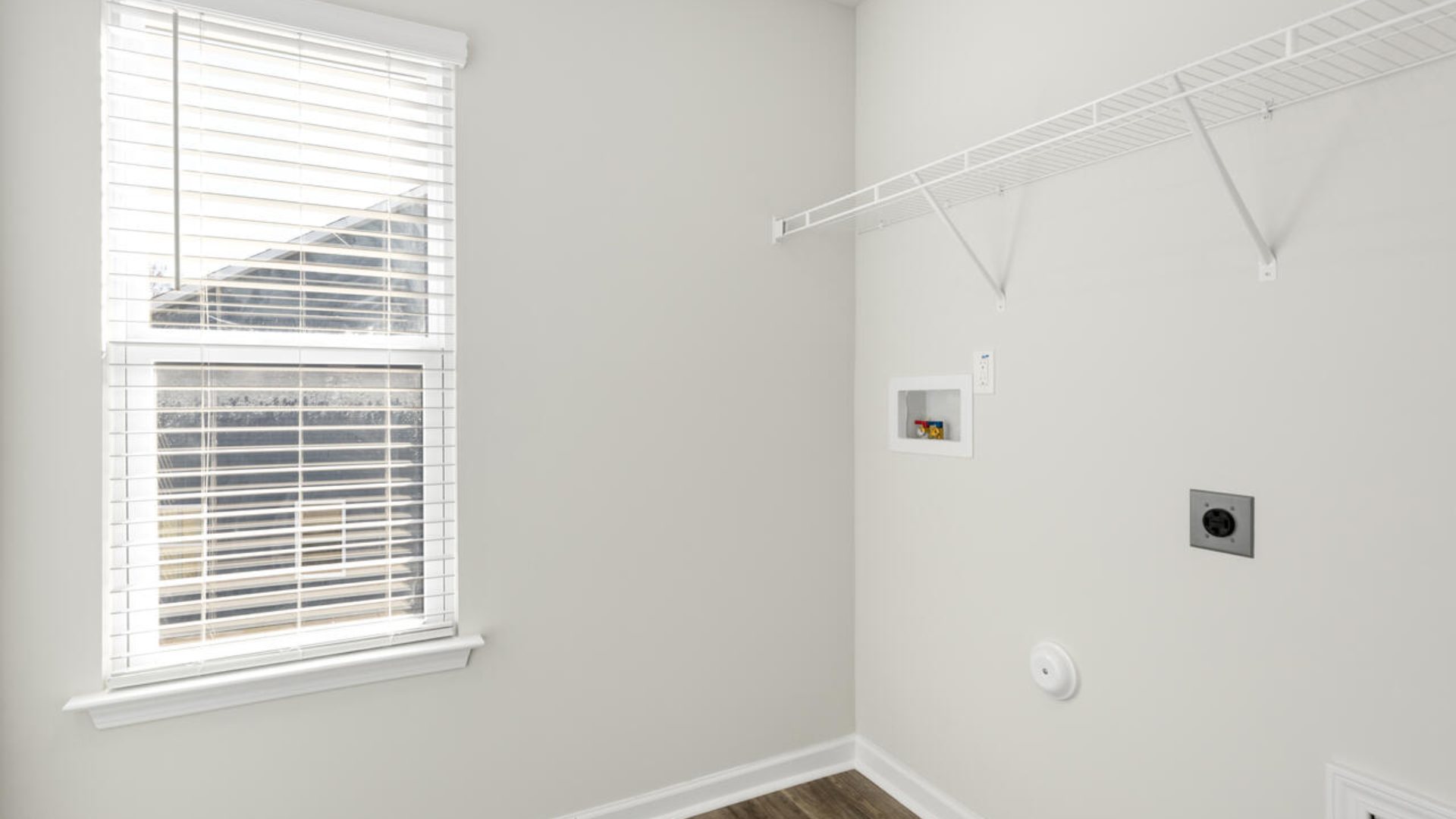 The Tillman floorplan features a first-floor primary suite, formal dining room, a large open living space divided by a kitchen island, and powder room on the first floor. Upstairs you are greeted by an convenient lof
