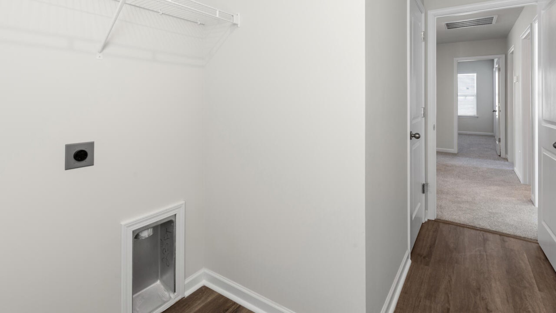 The Tillman floorplan features a first-floor primary suite, formal dining room, a large open living space divided by a kitchen island, and powder room on the first floor. Upstairs you are greeted by an convenient lof