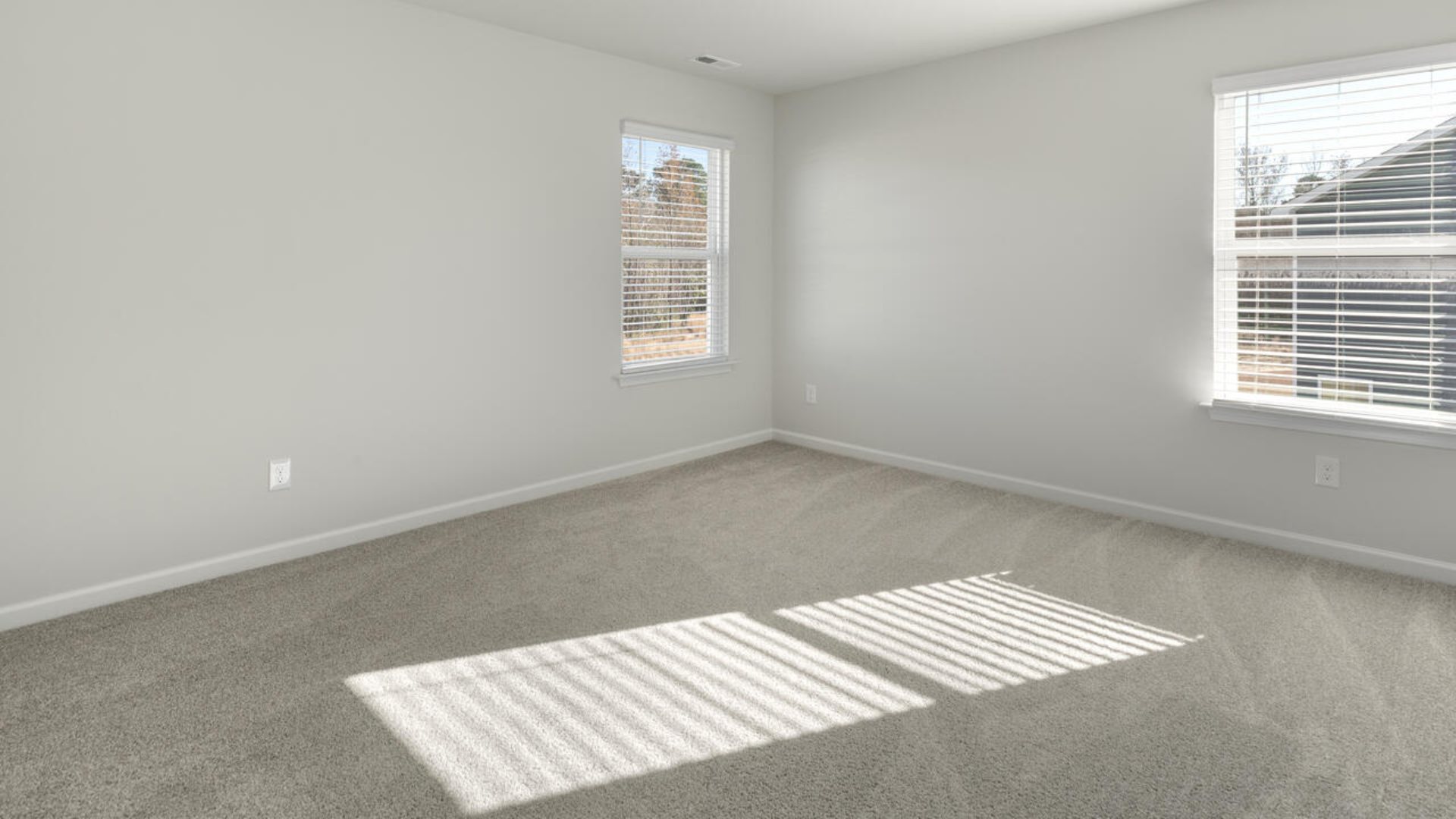 The Tillman floorplan features a first-floor primary suite, formal dining room, a large open living space divided by a kitchen island, and powder room on the first floor. Upstairs you are greeted by an convenient lof