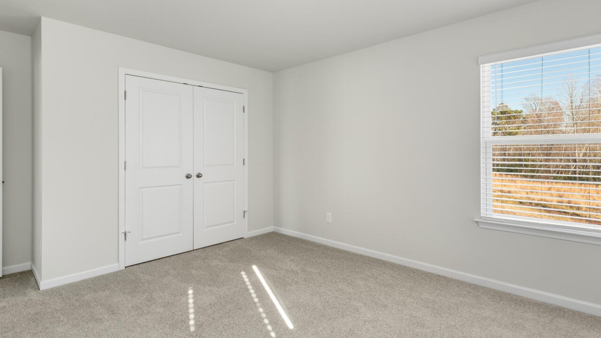 The Tillman floorplan features a first-floor primary suite, formal dining room, a large open living space divided by a kitchen island, and powder room on the first floor. Upstairs you are greeted by an convenient lof