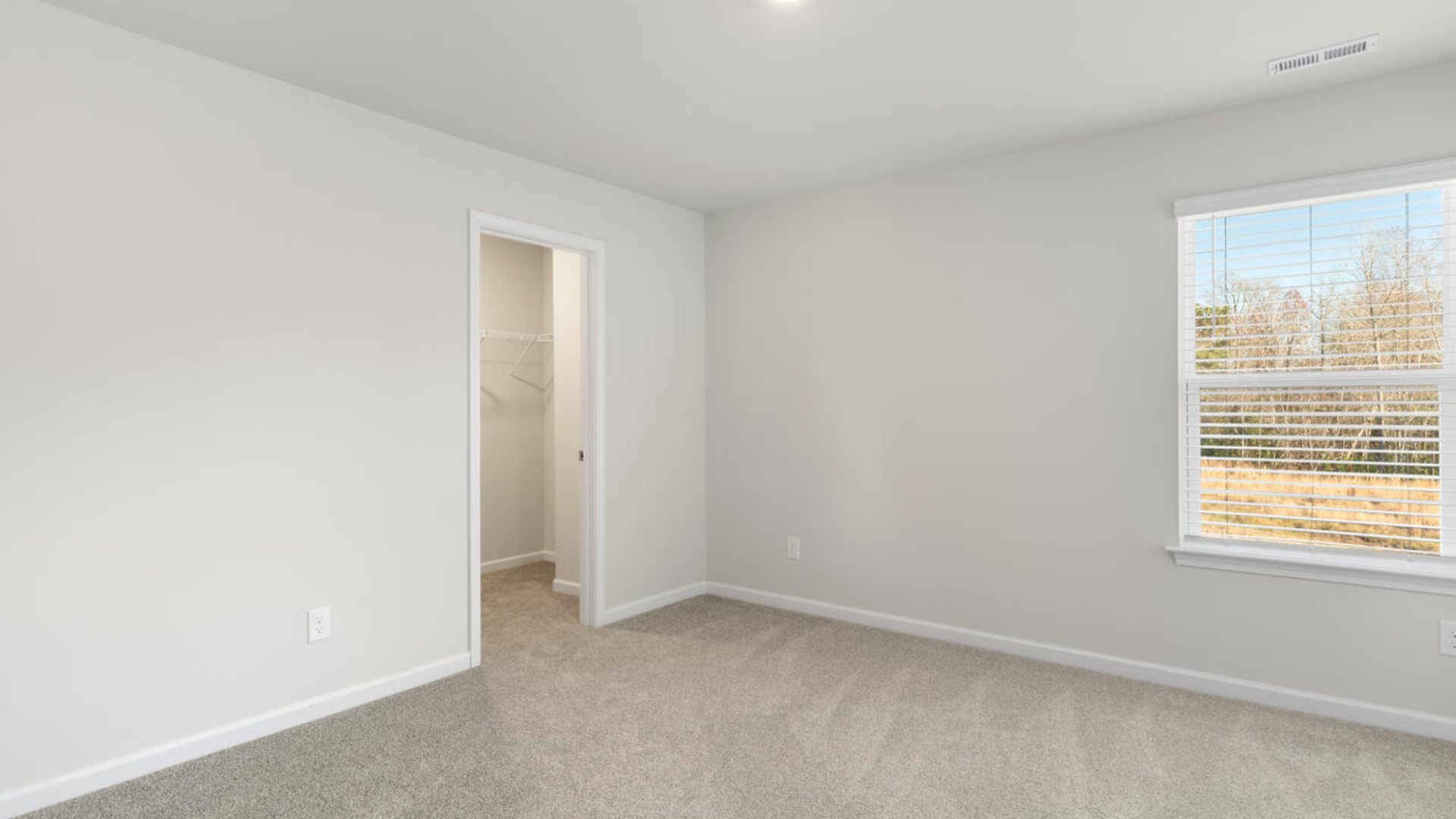 The Tillman floorplan features a first-floor primary suite, formal dining room, a large open living space divided by a kitchen island, and powder room on the first floor. Upstairs you are greeted by an convenient lof