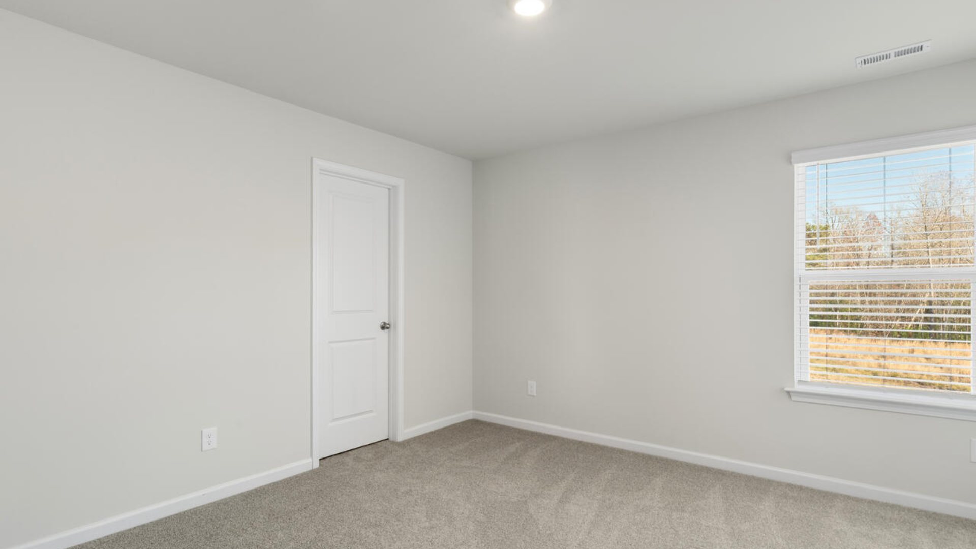 The Tillman floorplan features a first-floor primary suite, formal dining room, a large open living space divided by a kitchen island, and powder room on the first floor. Upstairs you are greeted by an convenient lof