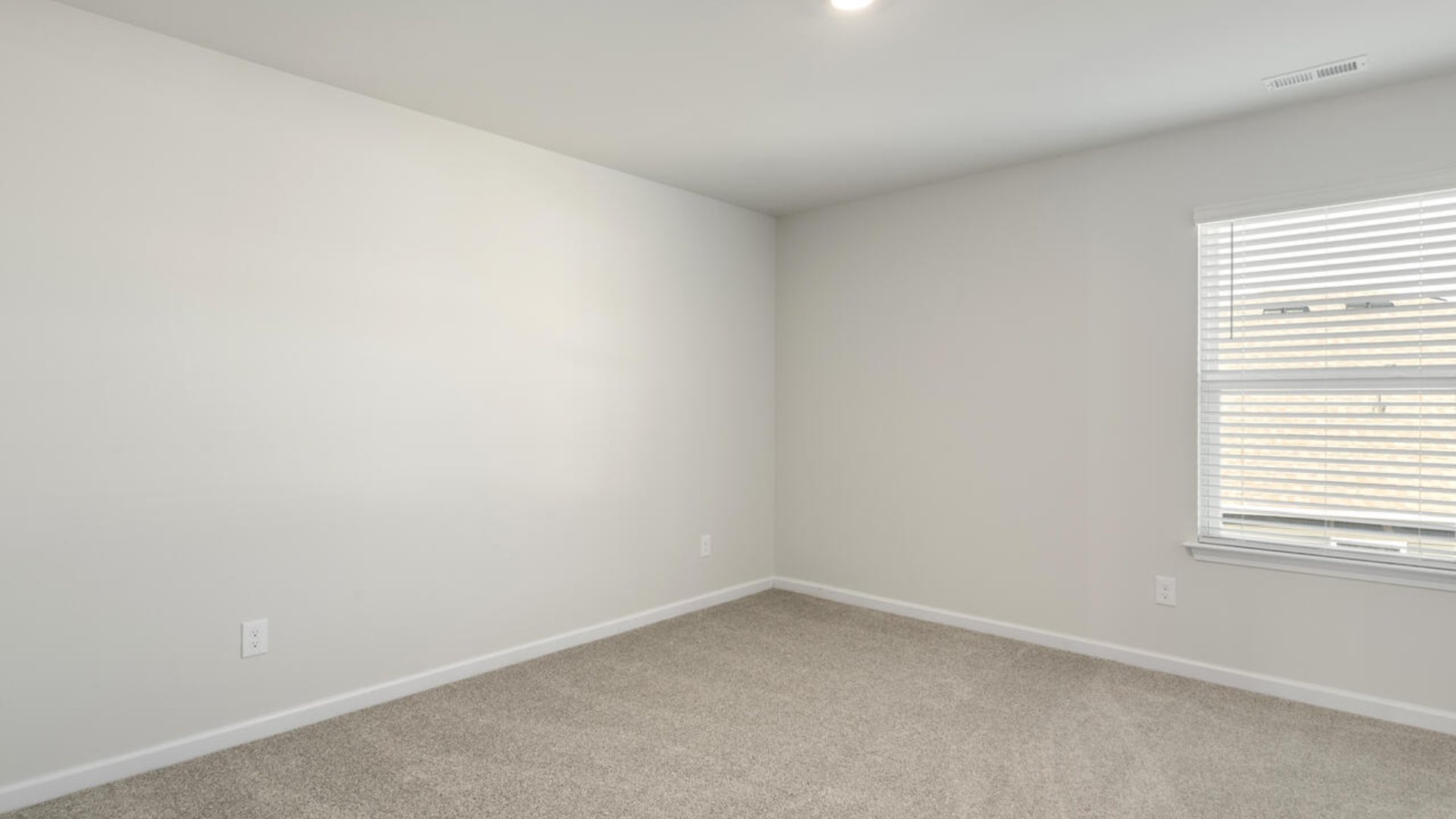 The Tillman floorplan features a first-floor primary suite, formal dining room, a large open living space divided by a kitchen island, and powder room on the first floor. Upstairs you are greeted by an convenient lof
