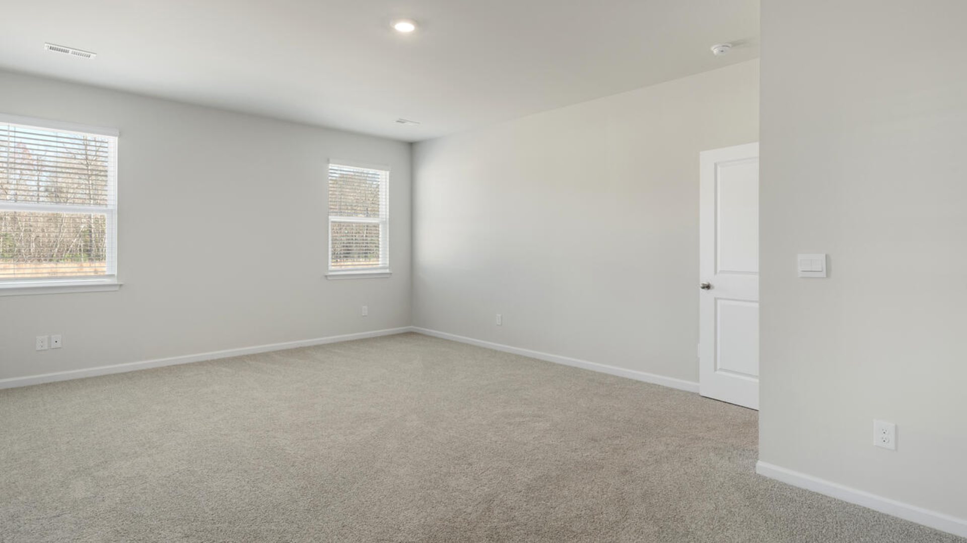 The Tillman floorplan features a first-floor primary suite, formal dining room, a large open living space divided by a kitchen island, and powder room on the first floor. Upstairs you are greeted by an convenient lof
