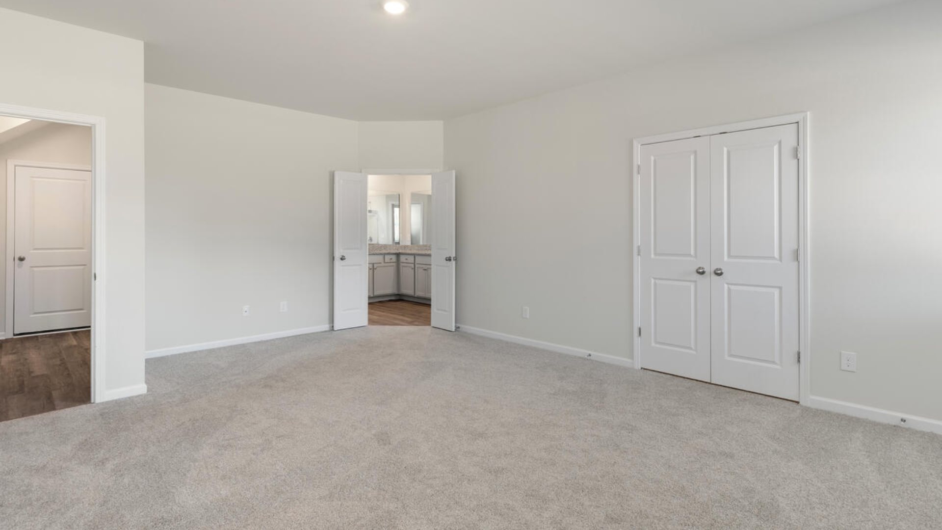 The Tillman floorplan features a first-floor primary suite, formal dining room, a large open living space divided by a kitchen island, and powder room on the first floor. Upstairs you are greeted by an convenient lof