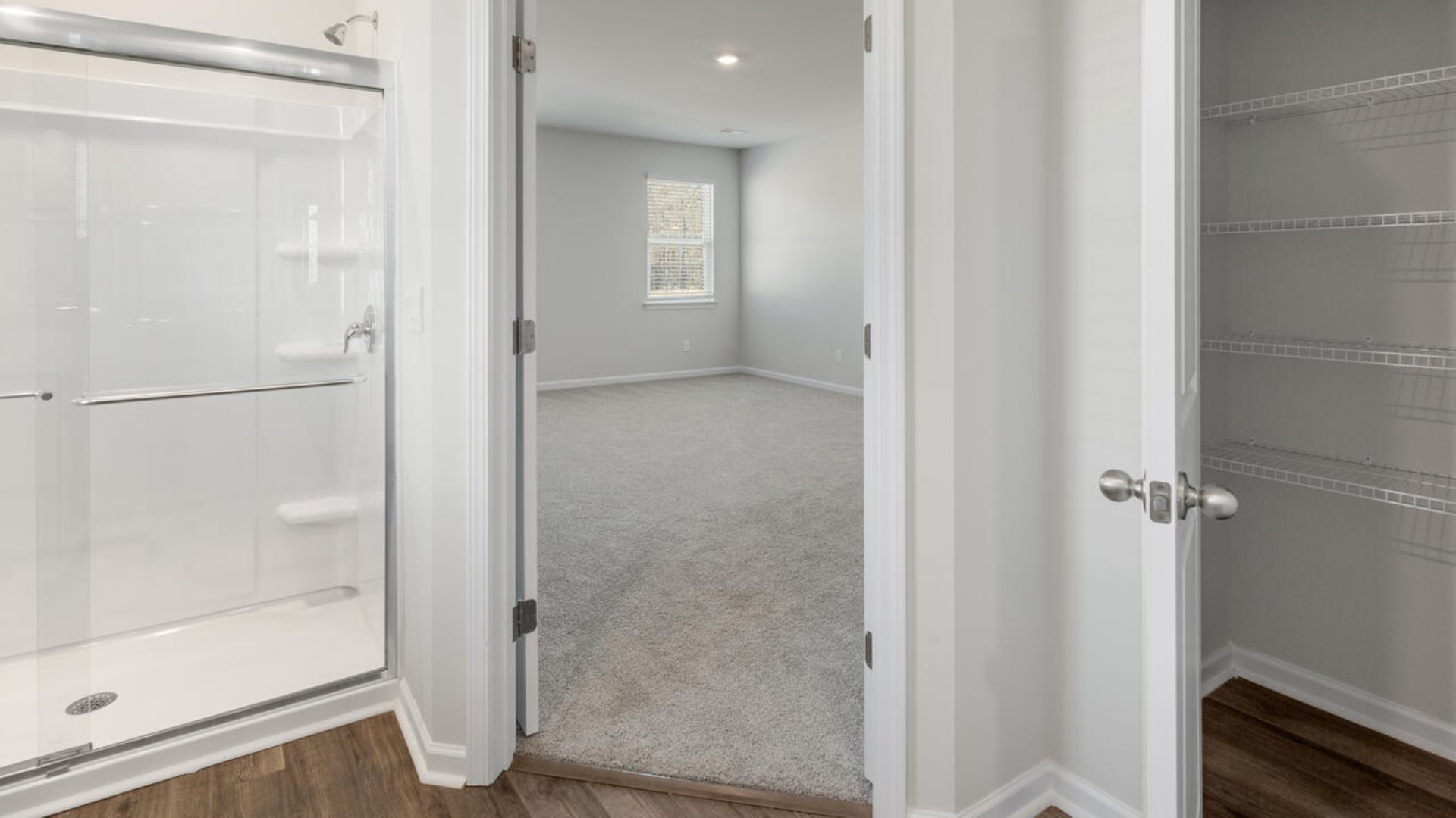 The Tillman floorplan features a first-floor primary suite, formal dining room, a large open living space divided by a kitchen island, and powder room on the first floor. Upstairs you are greeted by an convenient lof