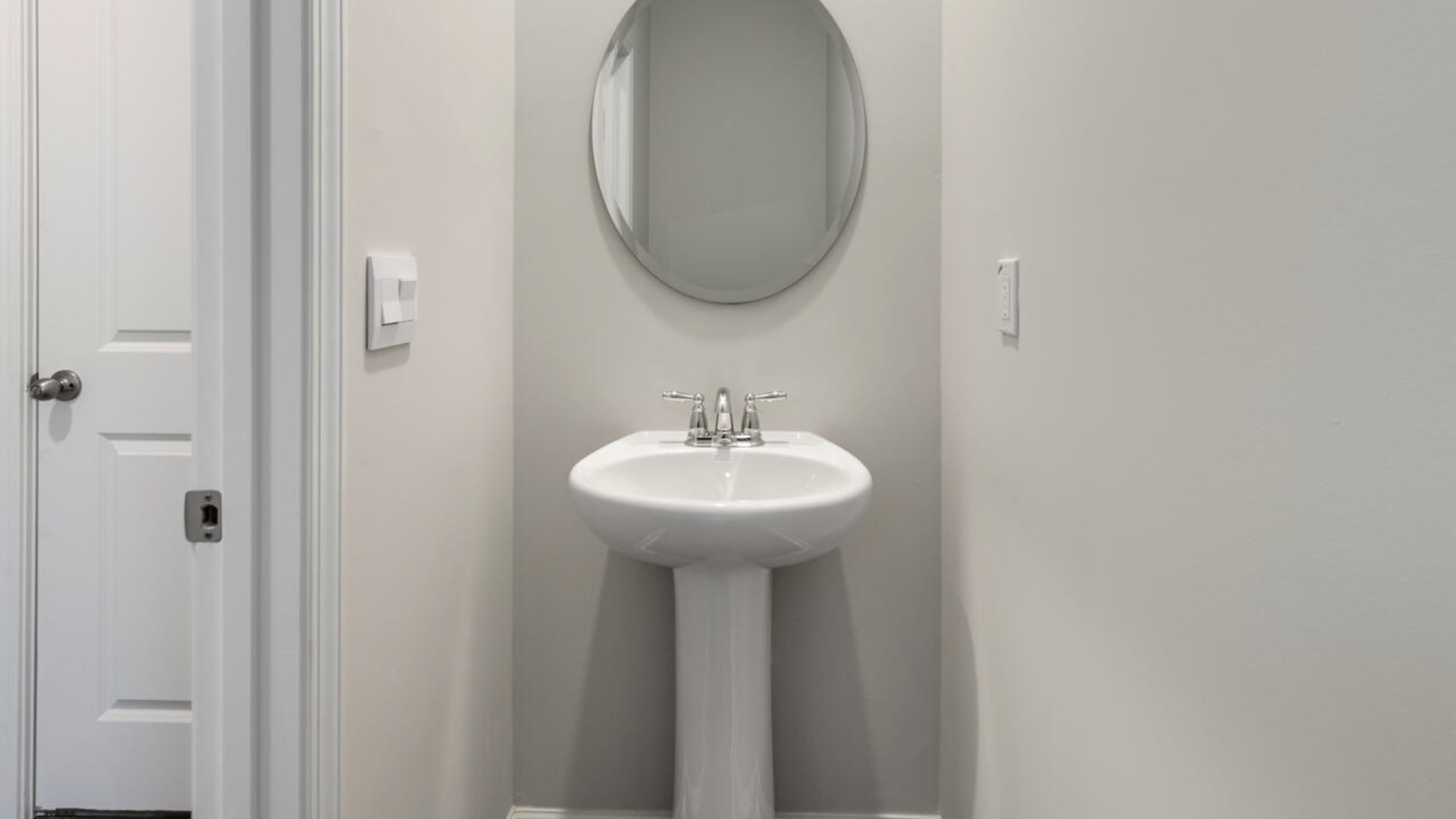 The Tillman floorplan features a first-floor primary suite, formal dining room, a large open living space divided by a kitchen island, and powder room on the first floor. Upstairs you are greeted by an convenient lof