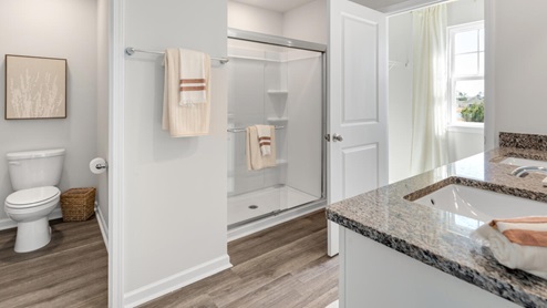 The primary suite on the second level offers a luxurious Primary bath with a soaking garden tub and separate shower, private bathroom, double vanities and a large walk-in clo