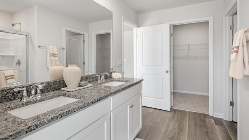The primary suite on the second level offers a luxurious Primary bath with a soaking garden tub and separate shower, private bathroom, double vanities and a large walk-in clo