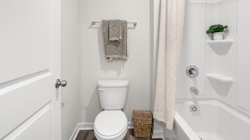 There are 3 additional bedrooms, a full bathroom, a walk-in laundry room, and a loft-style living room on the second level. Enjoy the patio perfect for entertaining and enjoying the Carolina evenings.