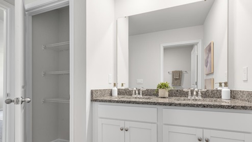There are 3 additional bedrooms, a full bathroom, a walk-in laundry room, and a loft-style living room on the second level. Enjoy the patio perfect for entertaining and enjoying the Carolina evenings.