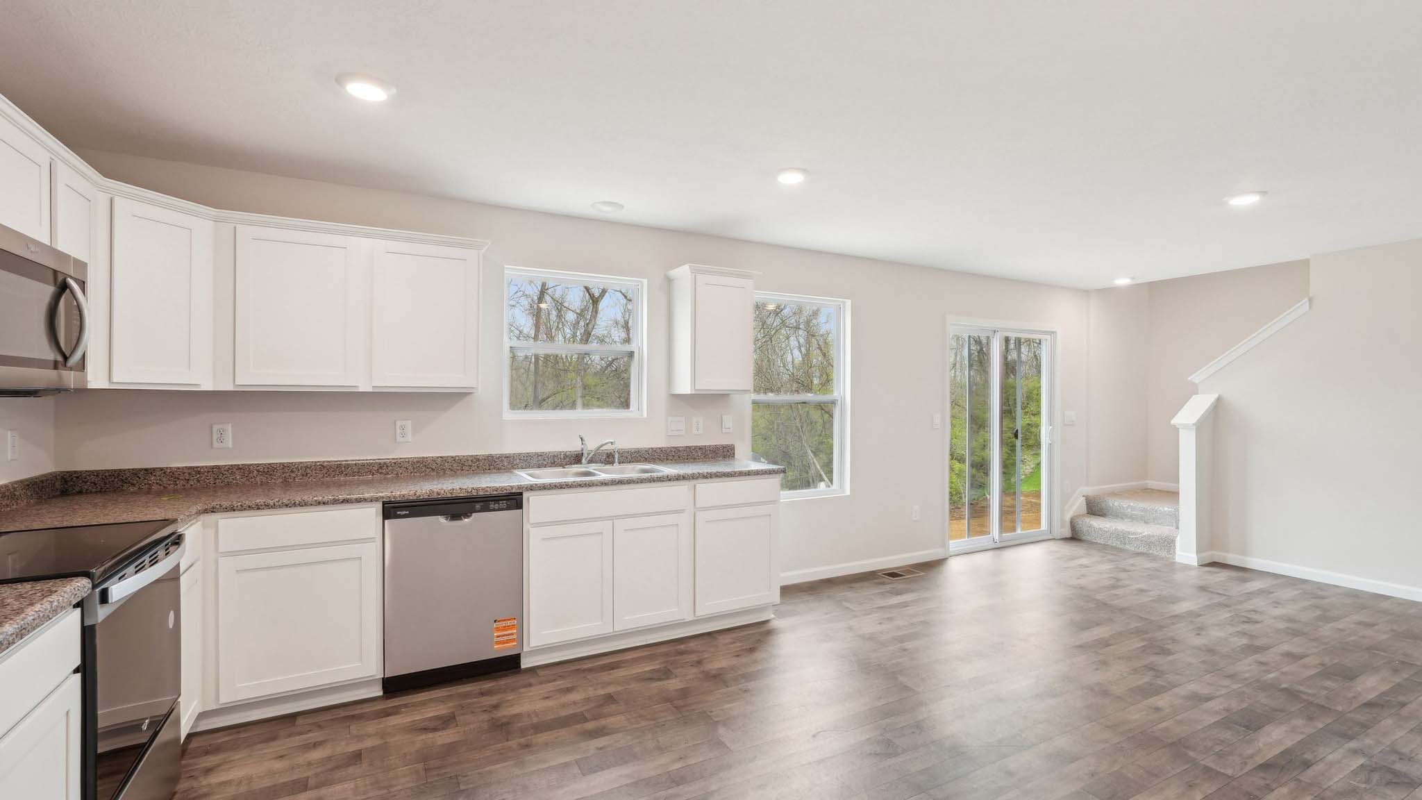 The living area is an open concept, where your kitchen, living, and dining areas blend seamlessly into a space perfect for everyday living and entertaining. There is a downstairs powder room.