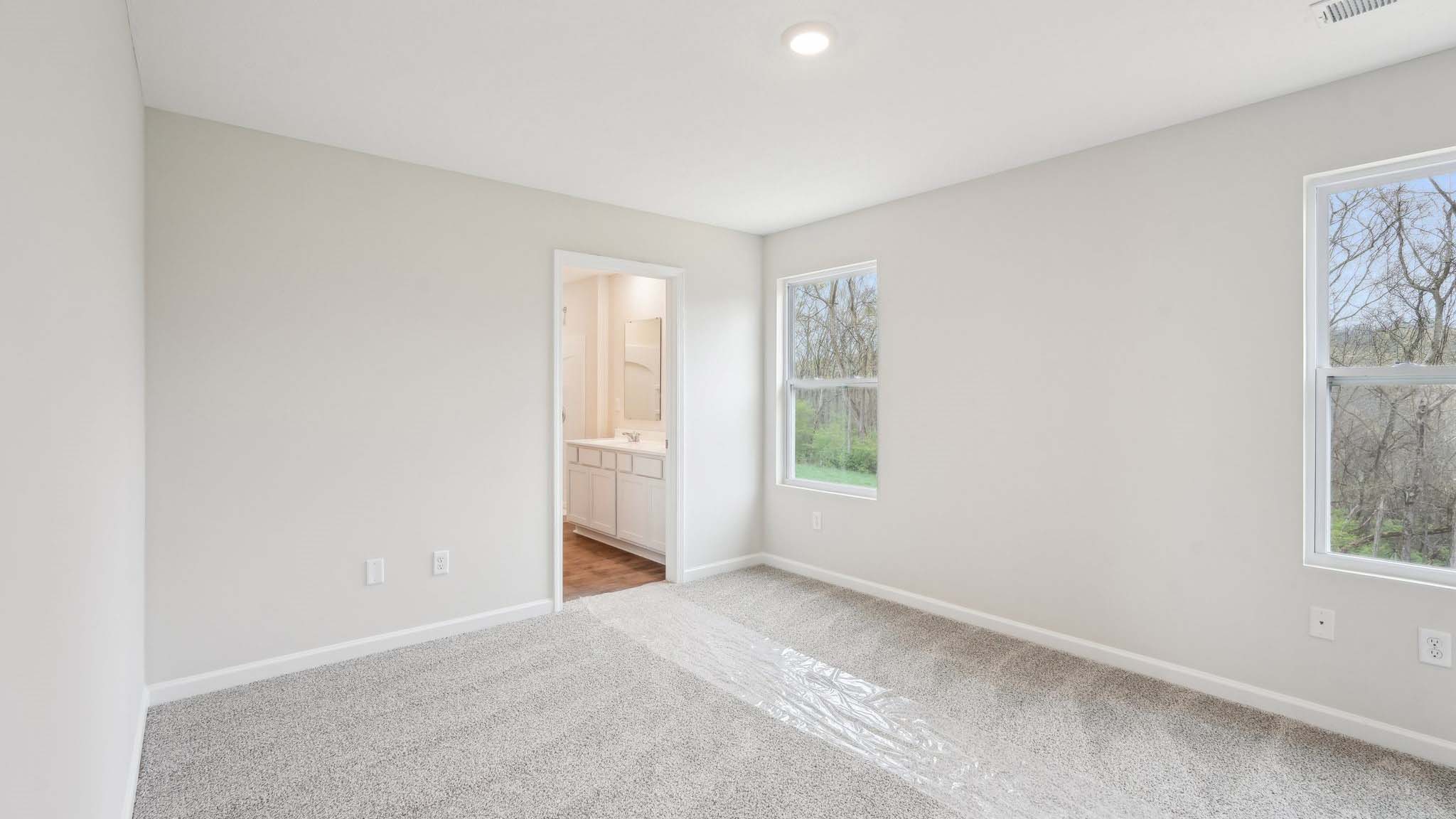 Upstairs is a loft that leads into the spacious primary bedroom. The primary bedroom features a walk-in-closet as well as a comfortable en-suite bathroom and sharing a sink isn’t a worry with the double vanity.