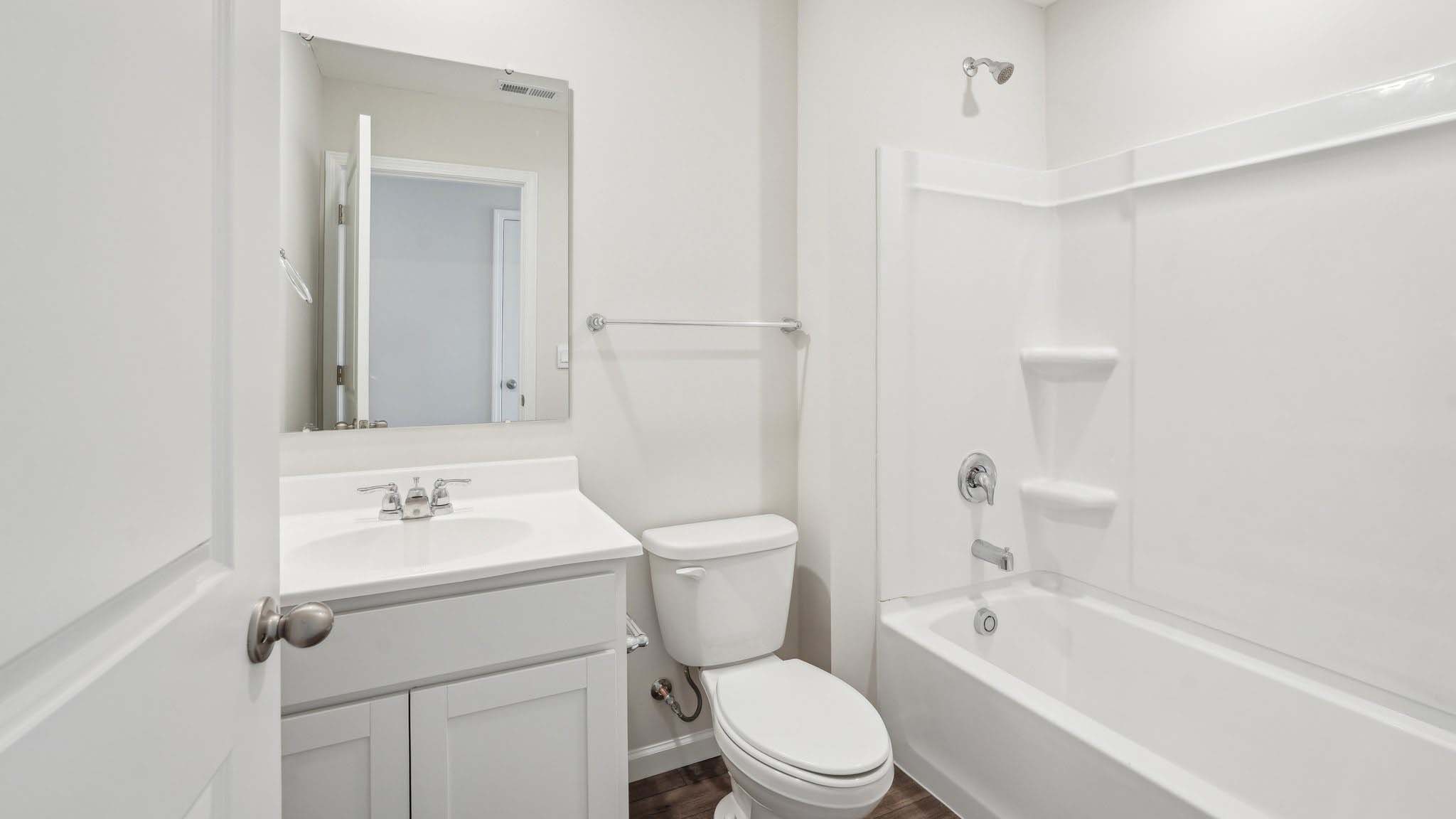 The second floor also features two additional bedrooms that share a bathroom and a large loft space. Enjoy the convenience of a laundry room upstairs.
