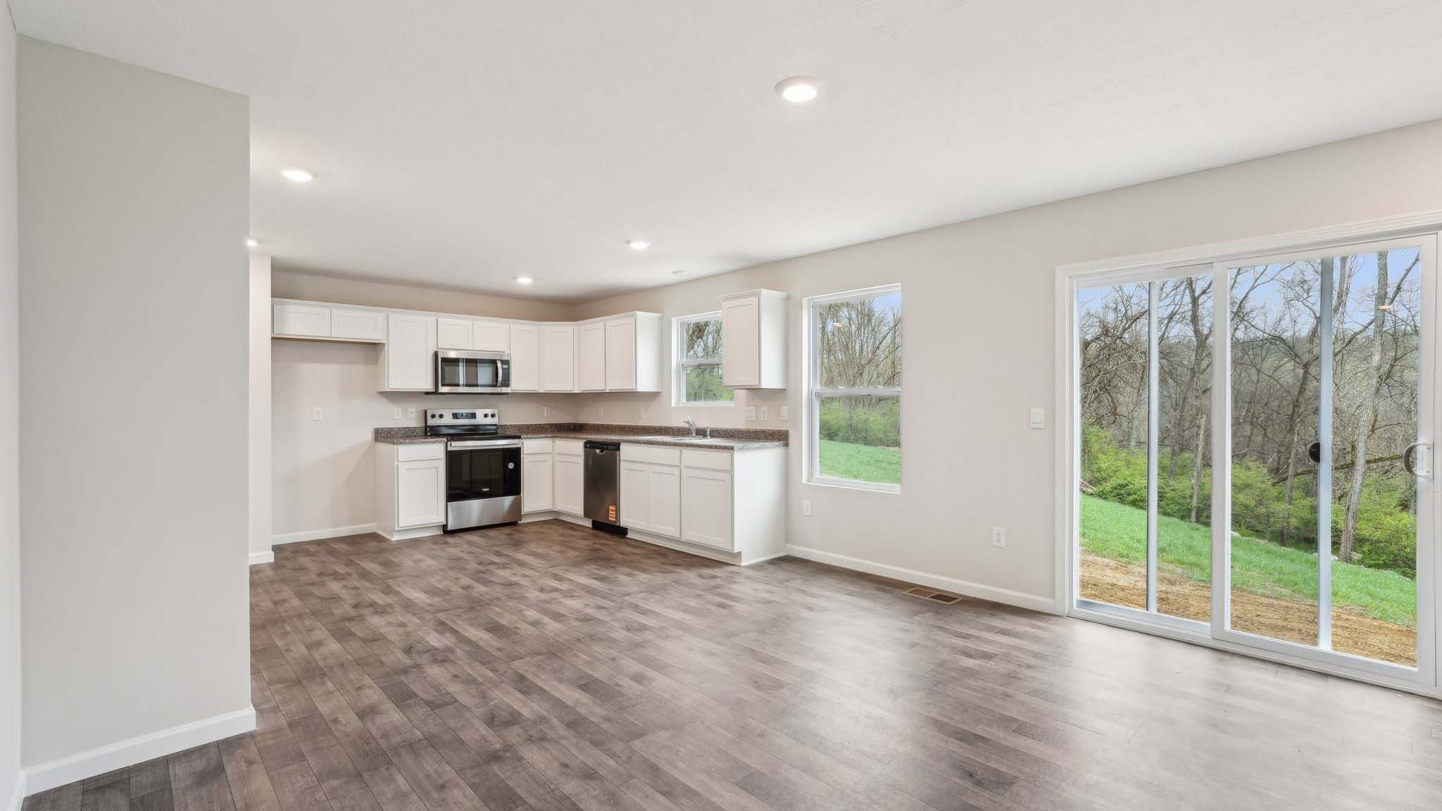 The living area is an open concept, where your kitchen, living, and dining areas blend seamlessly into a space perfect for everyday living and entertaining. There is a downstairs powder room.