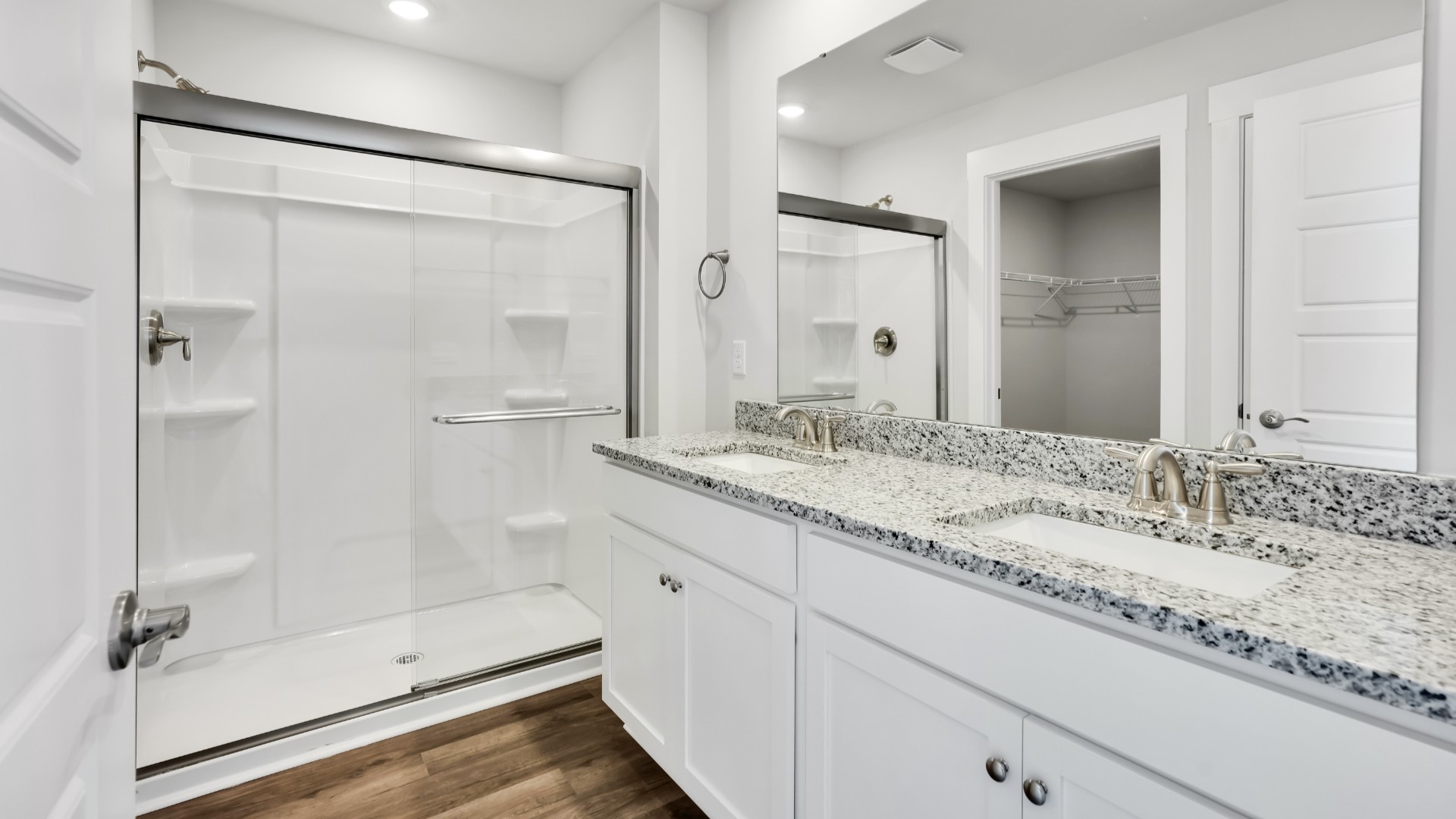 The primary bedroom features a walk-in-closet as well as a comfortable en-suite bathroom and sharing a sink isn’t a worry with the double vanity.