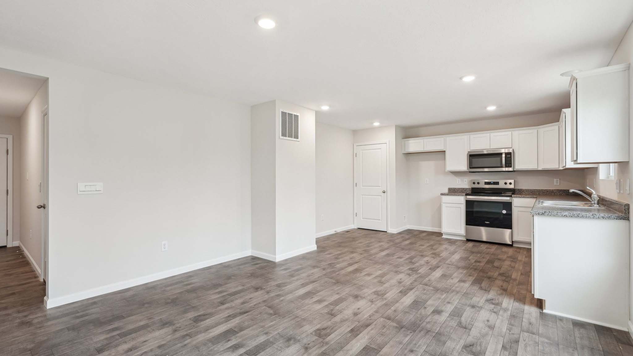 The living area is an open concept, where your kitchen, living, and dining areas blend seamlessly into a space perfect for everyday living and entertaining. There is a downstairs powder room.