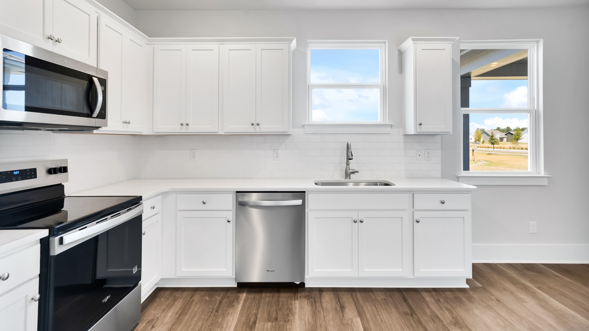 The modern kitchen with a pantry overlooks the cozy living area. Upstairs is a loft that leads into the spacious primary bedroom. The primary bedroom features a walk-in-closet as well as a comfortable en-suite bathroom and sharing a sink isn’t a worry with the double vanity.