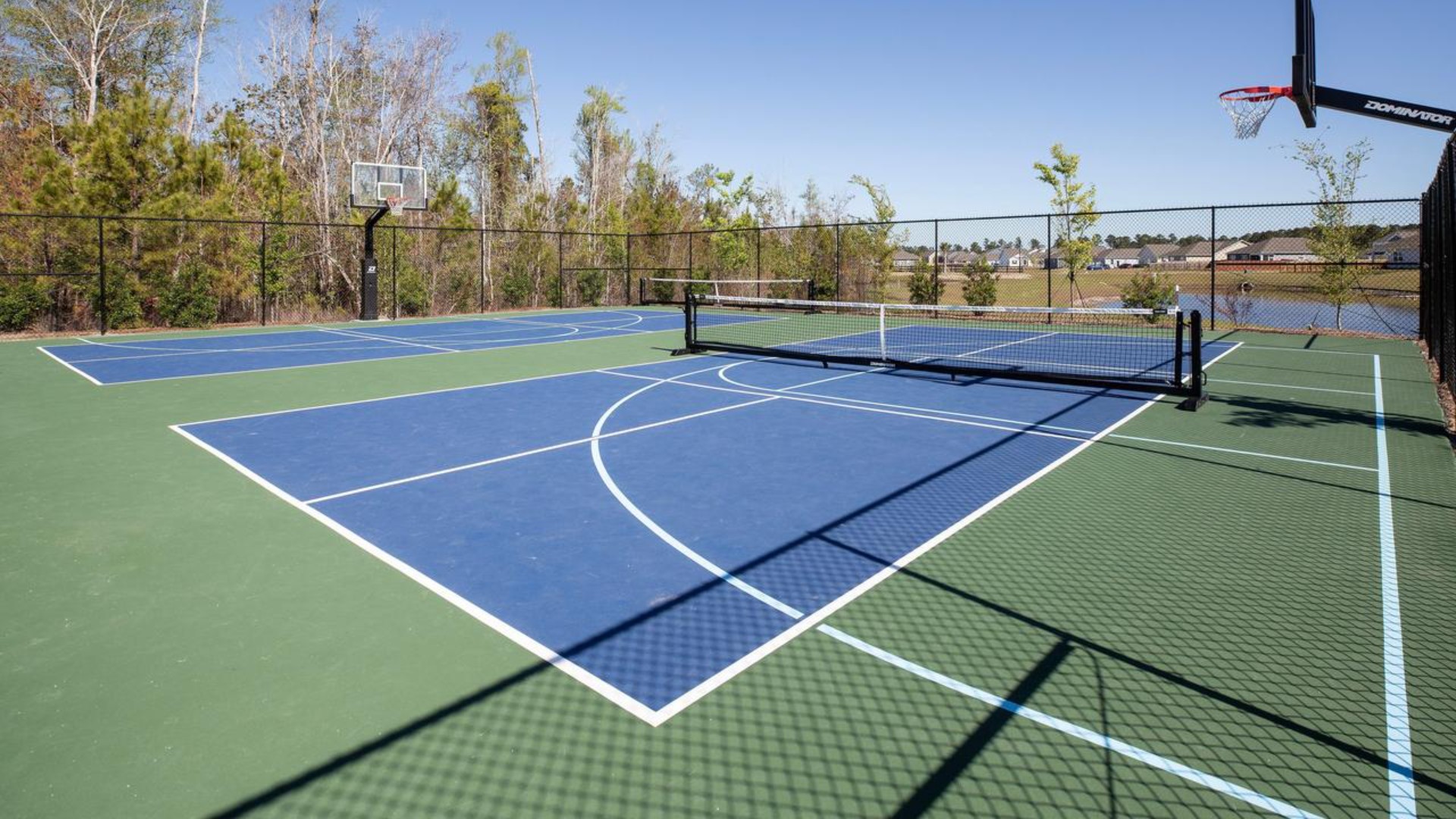 The amenity center that includes a swimming pool, multi-sport court, splashpad, playground, and fire pit, ensuring a well-rounded and enjoyable living experience.