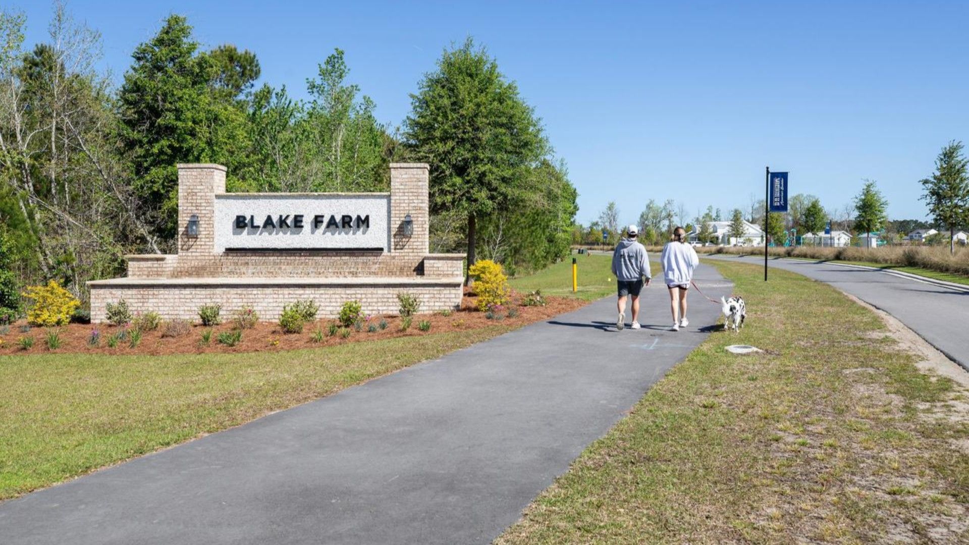 The amenity center that includes a swimming pool, multi-sport court, splashpad, playground, and fire pit, ensuring a well-rounded and enjoyable living experience.