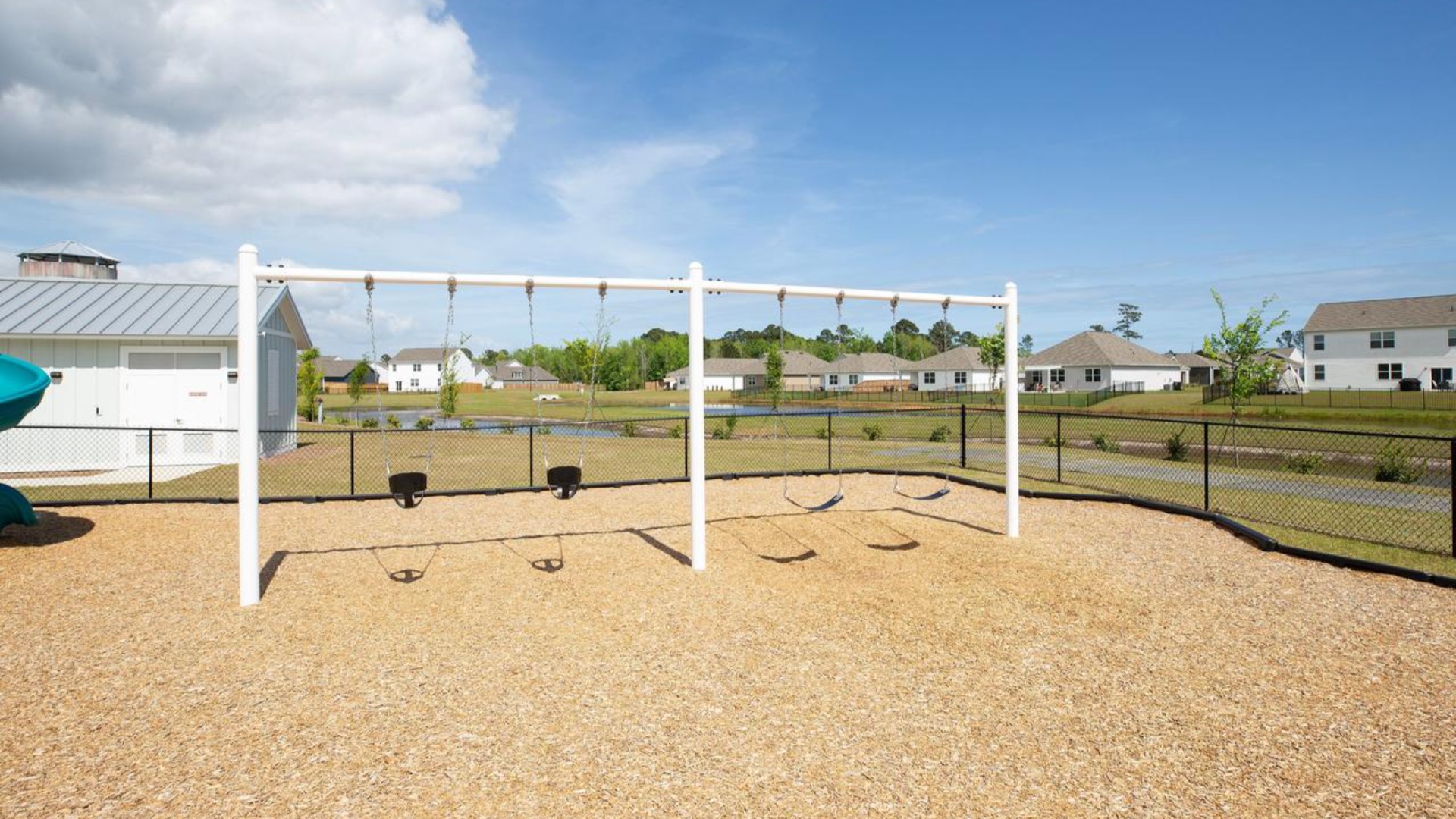 The amenity center that includes a swimming pool, multi-sport court, splashpad, playground, and fire pit, ensuring a well-rounded and enjoyable living experience.