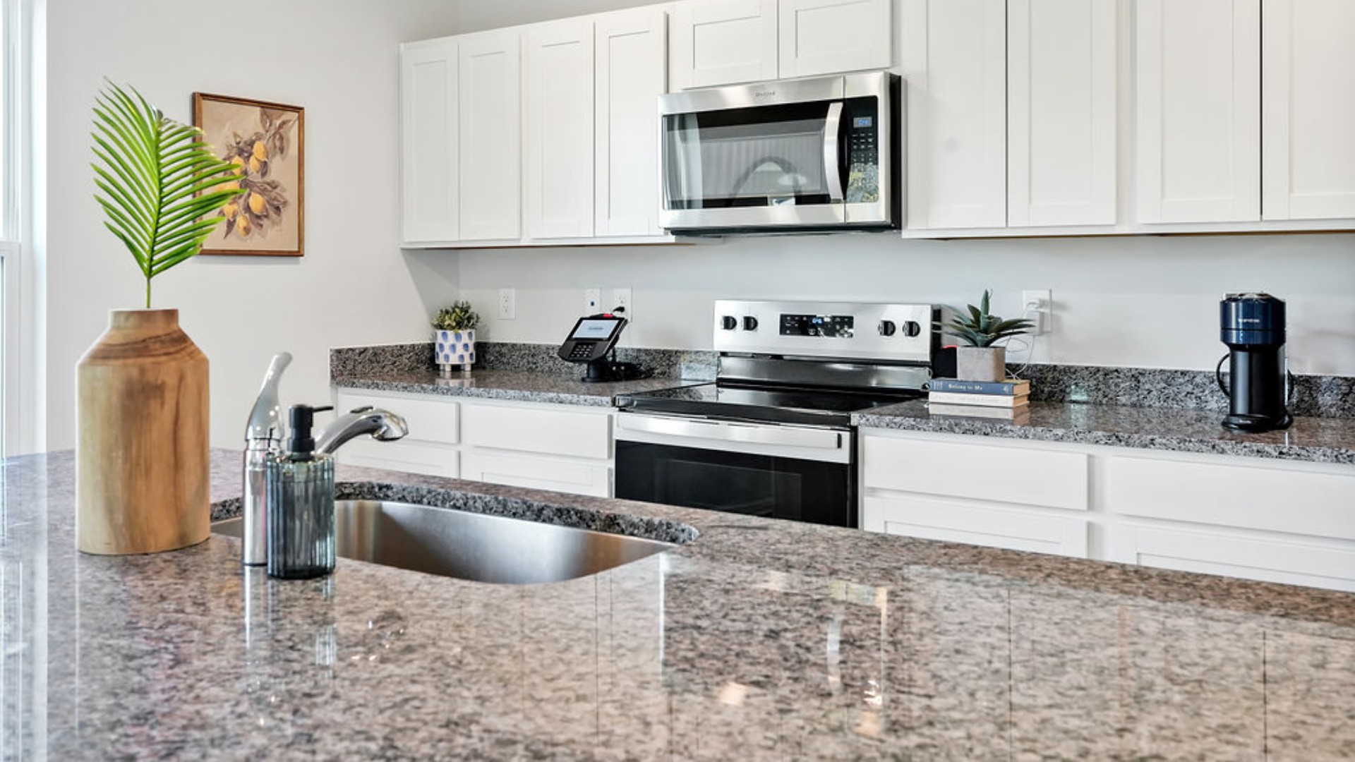 The Galen is a 2,340 sq ft home featuring 4 Bedrooms and 2.5 Baths. Its open-concept design includes a kitchen with granite countertops and stainless steel appliances, an island, and a walk-in pantry, while the large Great Room is ideal for entertaining.