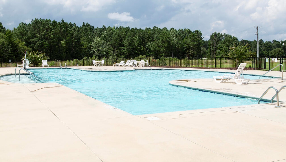 The community amenities include a pool, cabana with kitchen and walking trails.