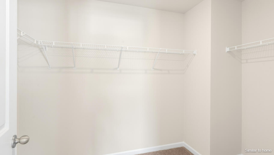 Upstairs, the Primary Suite offers a private bathroom, and the rest of the second floor includes three additional bedrooms and a convenient laundry room