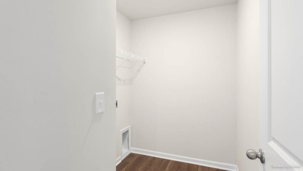 Upstairs, the Primary Suite offers a private bathroom, and the rest of the second floor includes three additional bedrooms and a convenient laundry room