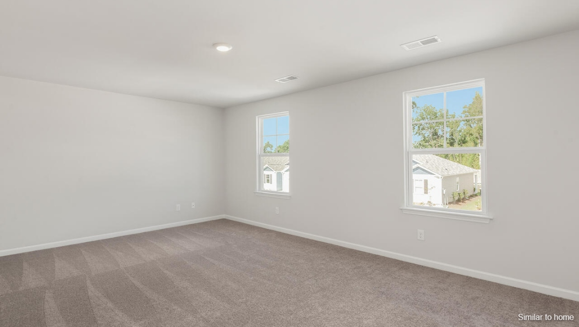 Upstairs, the Primary Suite offers a private bathroom, and the rest of the second floor includes three additional bedrooms and a convenient laundry room