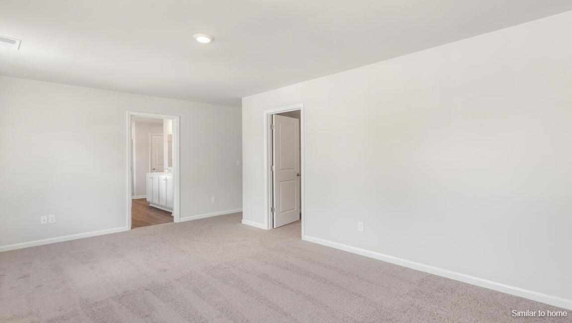 Upstairs, the Primary Suite offers a private bathroom, and the rest of the second floor includes three additional bedrooms and a convenient laundry room