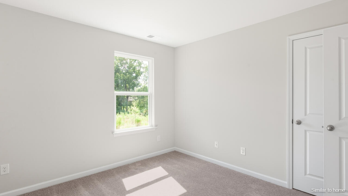 the rest of the second floor includes three additional bedrooms and a convenient laundry room.