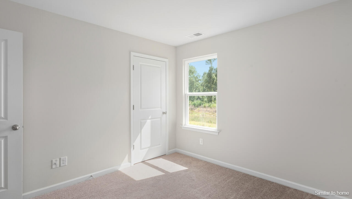 the rest of the second floor includes three additional bedrooms and a convenient laundry room.