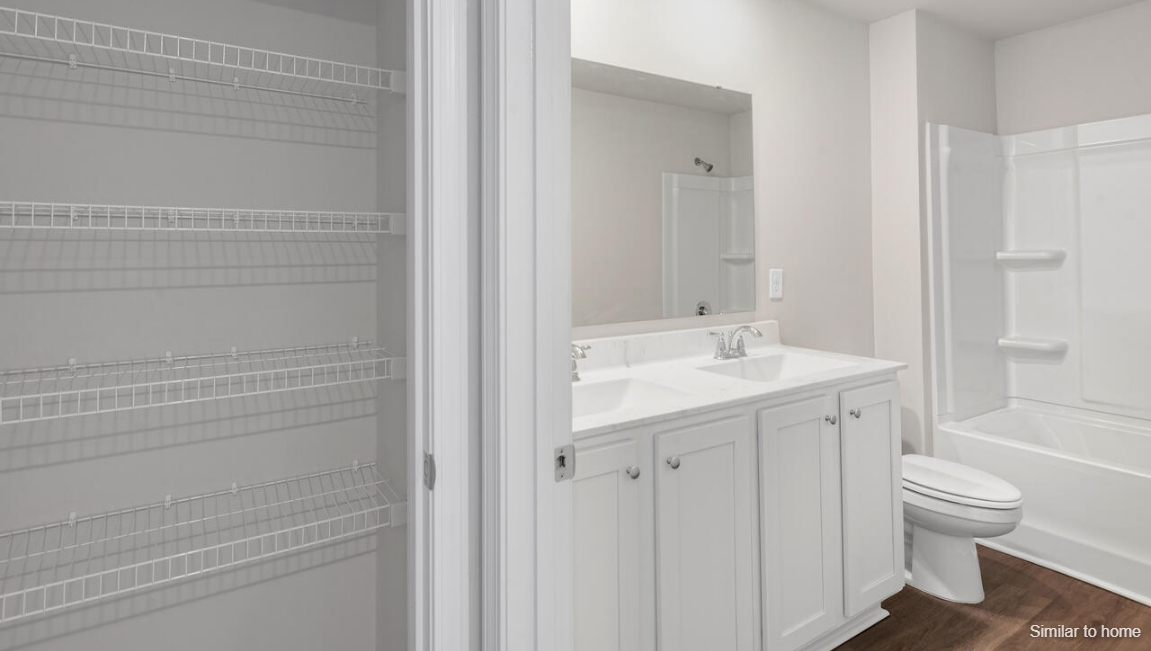 the rest of the second floor includes three additional bedrooms and a convenient laundry room.