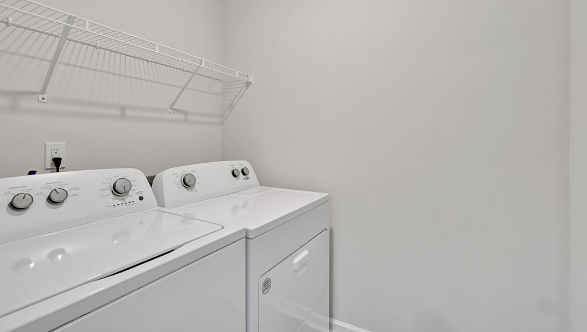 spacious primary suite upstairs features two walk-in closets, a spa-like bathroom with a double vanity, stand-up shower, and private water closet. Granite countertops are included in the bathroom and kitchen.