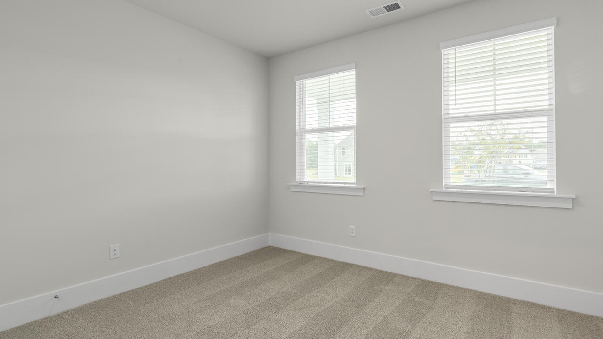Also, enjoy a split bedroom layout with the remaining two bedrooms can be found towards the front of the home. In every bedroom you’ll have carpeted floors and a closet in each room.