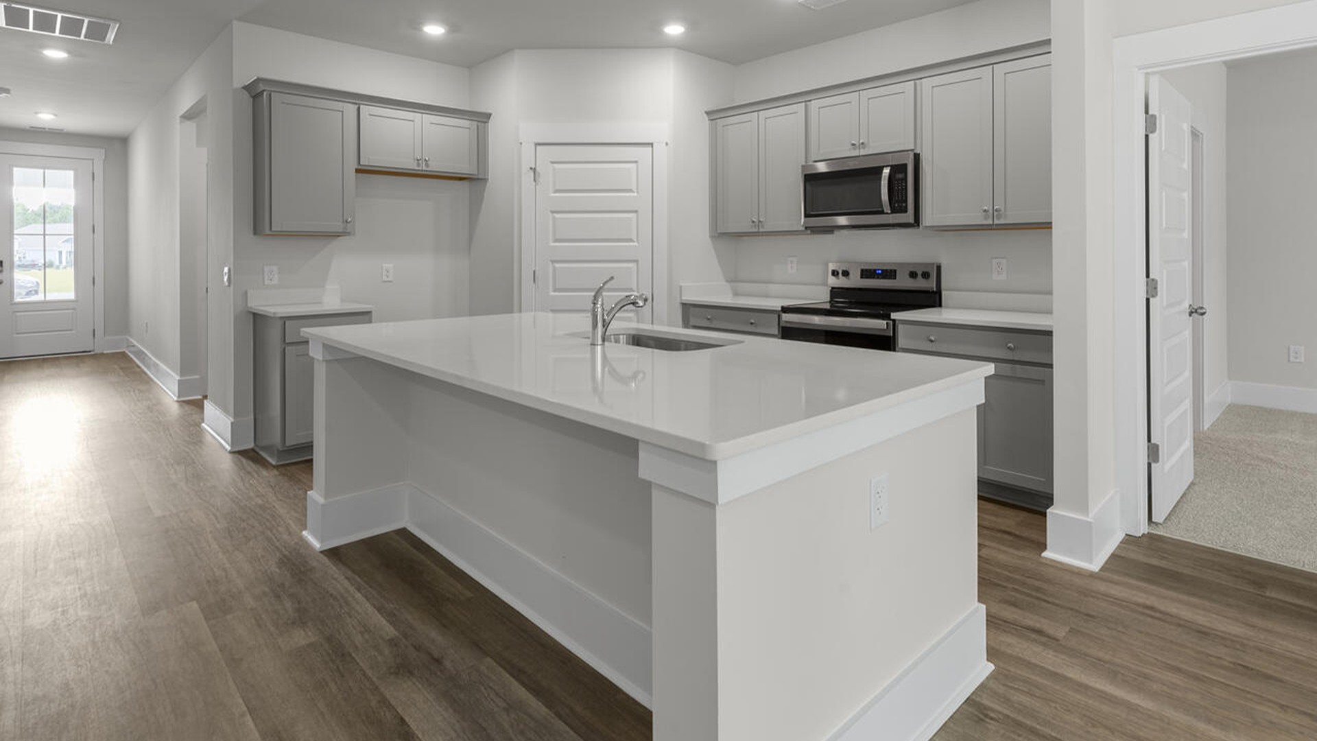 The Bradford is a versatile plan with an open concept kitchen, living, and dining area! The kitchen comes finished with beautiful granite countertops, stainless steel appliances, single-bowl sink and tile backsplash.