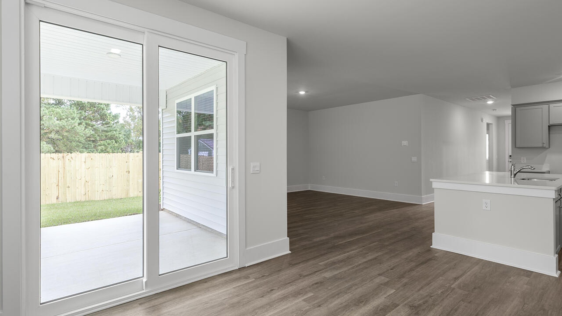 The Bradford is a versatile plan with an open concept kitchen, living, and dining area! The kitchen comes finished with beautiful granite countertops, stainless steel appliances, single-bowl sink and tile backsplash.