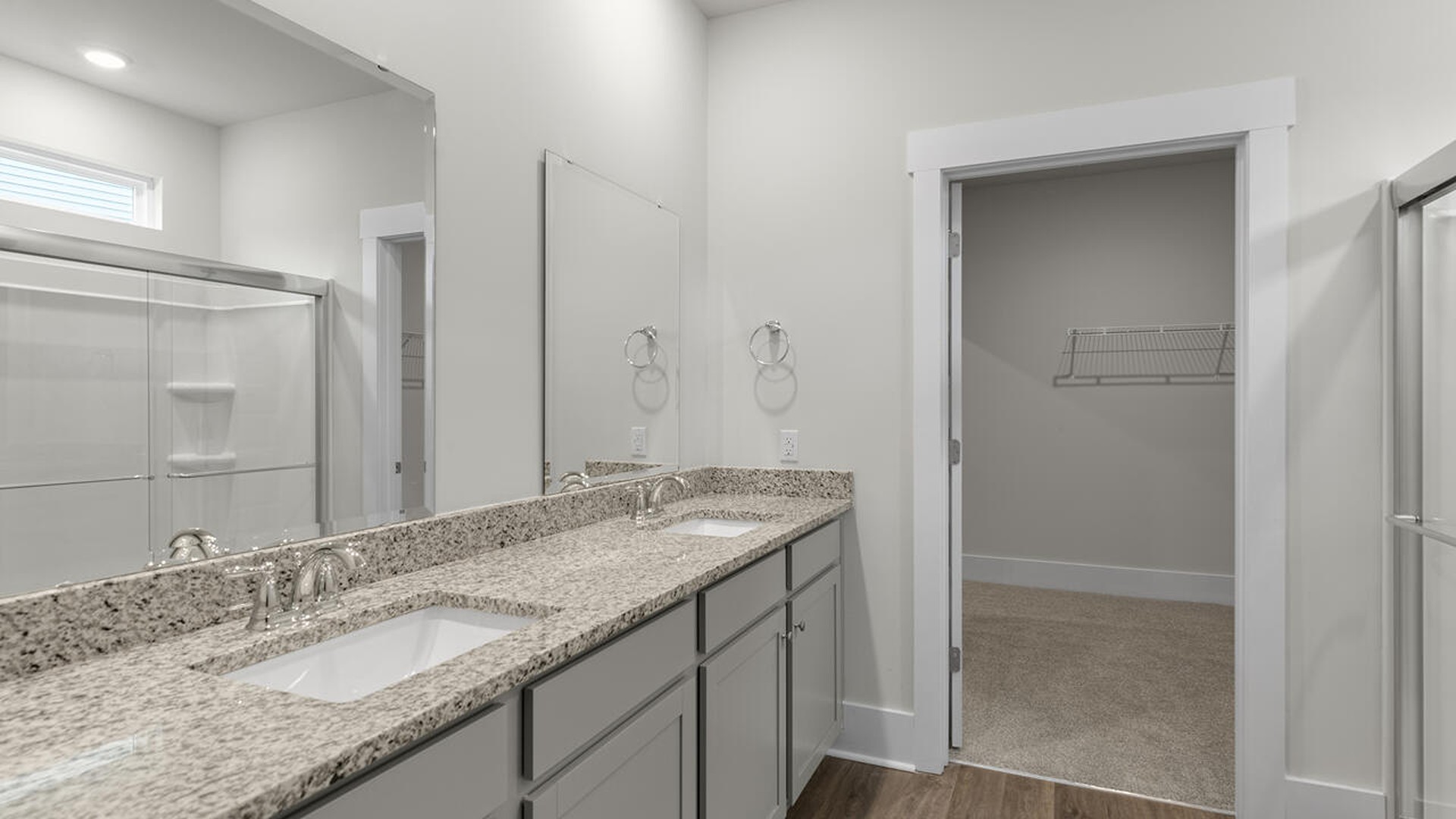 The primary bedroom has its own attached bathroom that features a walk-in closet and all the space you need to get ready in the morning.