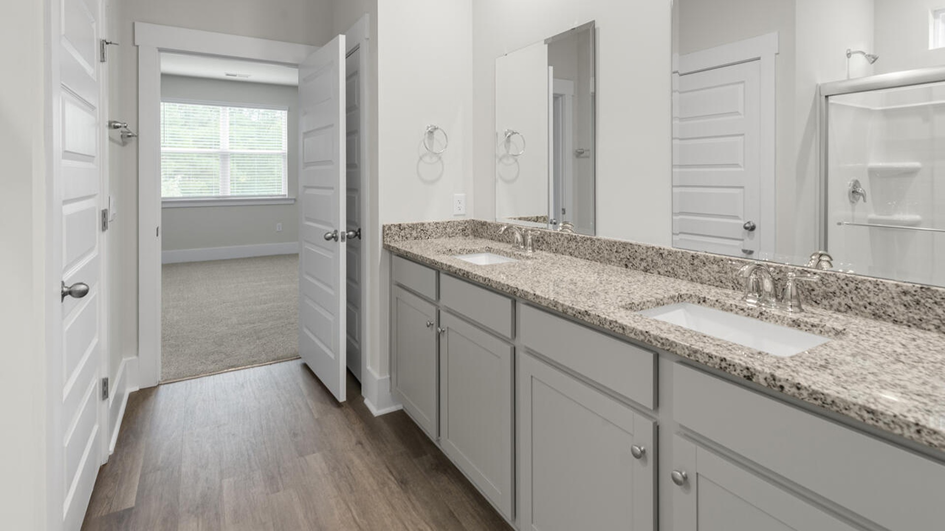 The primary bedroom has its own attached bathroom that features a walk-in closet and all the space you need to get ready in the morning.