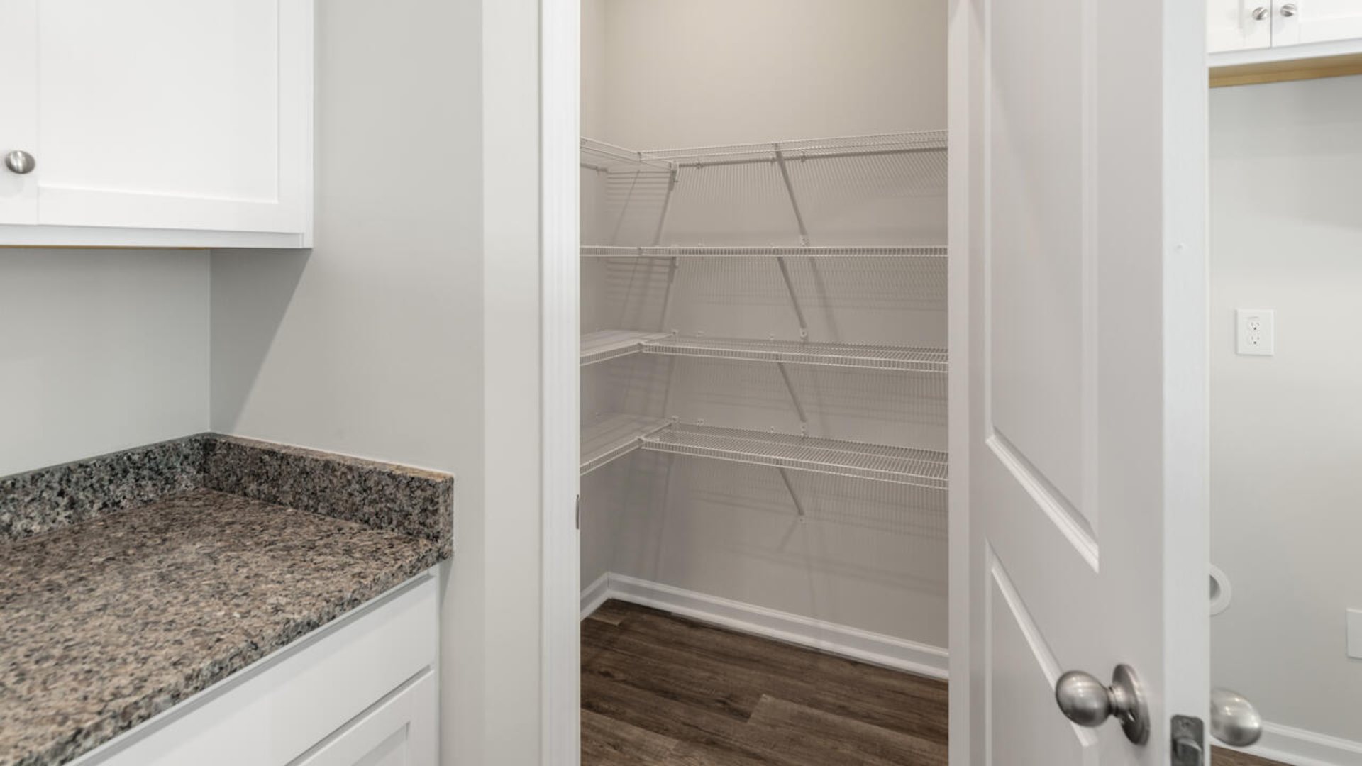 The Darby floor plan features an open-concept layout with a kitchen equipped with granite countertops, single bowl stainless sink, stainless steel appliances, including a smooth-top electric range, microwave, and dishwasher. The large island is great for gatherings.