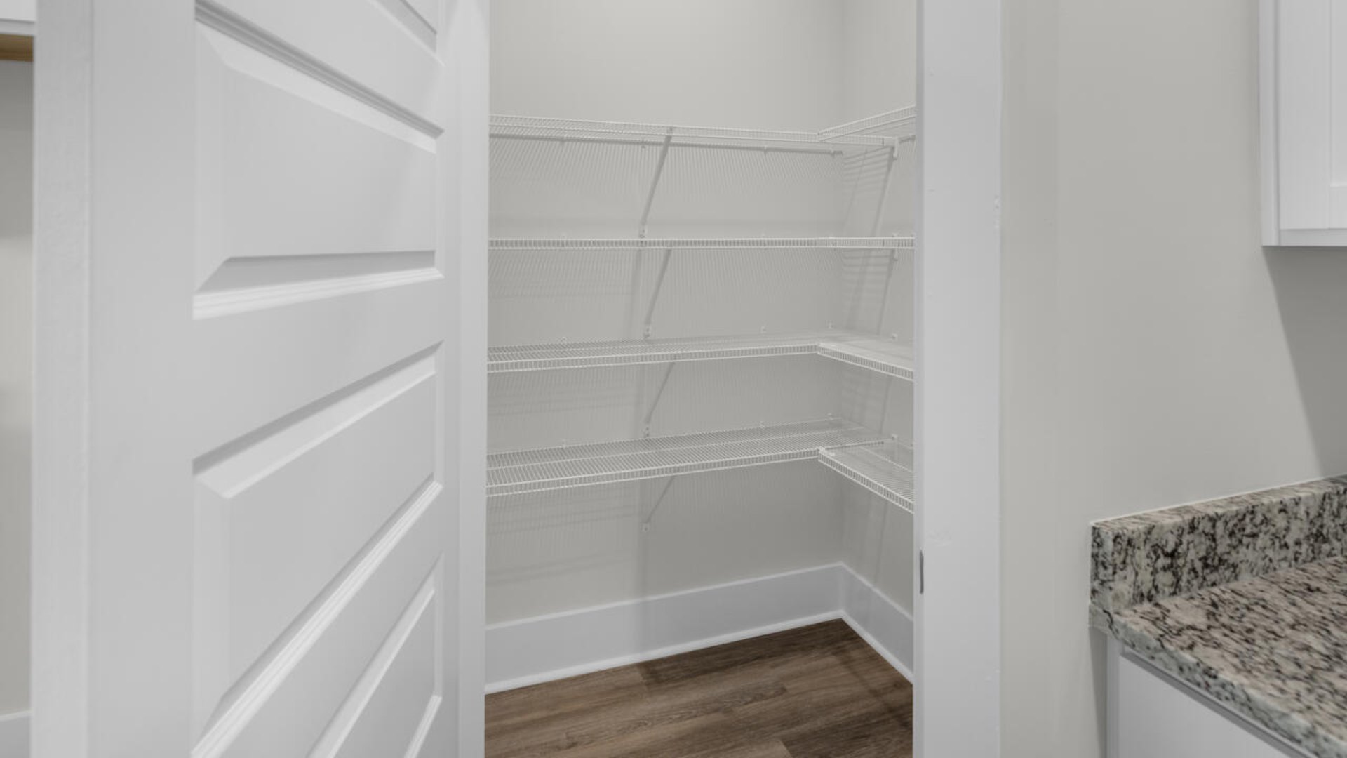 Its open layout seamlessly connects the living, dining, and kitchen areas, creating a harmonious flow throughout the space. The design includes four spacious bedrooms, offering privacy and comfort for everyone.