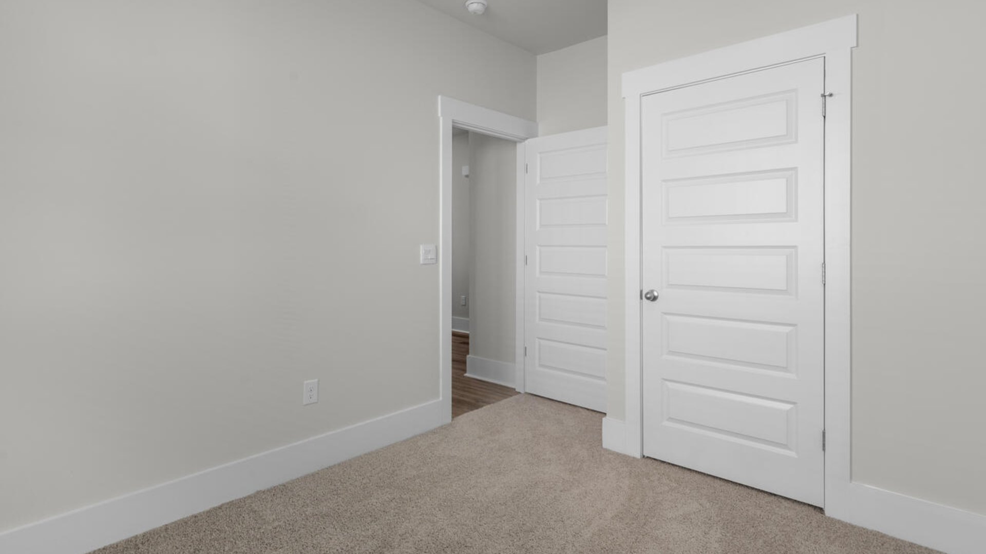 On the first floor, there are two additional bedrooms with low-maintenance LVP flooring and an office with French doors.
