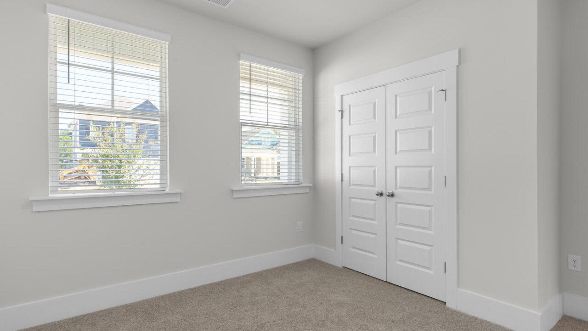 The primary suite as well as on suite is sure to impress with double vanities and a massive walk-in closet. A large, covered porch perfect for entertaining and enjoying the Carolina evenings