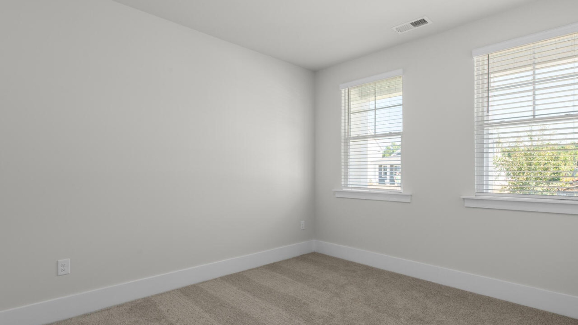 The primary suite as well as on suite is sure to impress with double vanities and a massive walk-in closet. A large, covered porch perfect for entertaining and enjoying the Carolina evenings