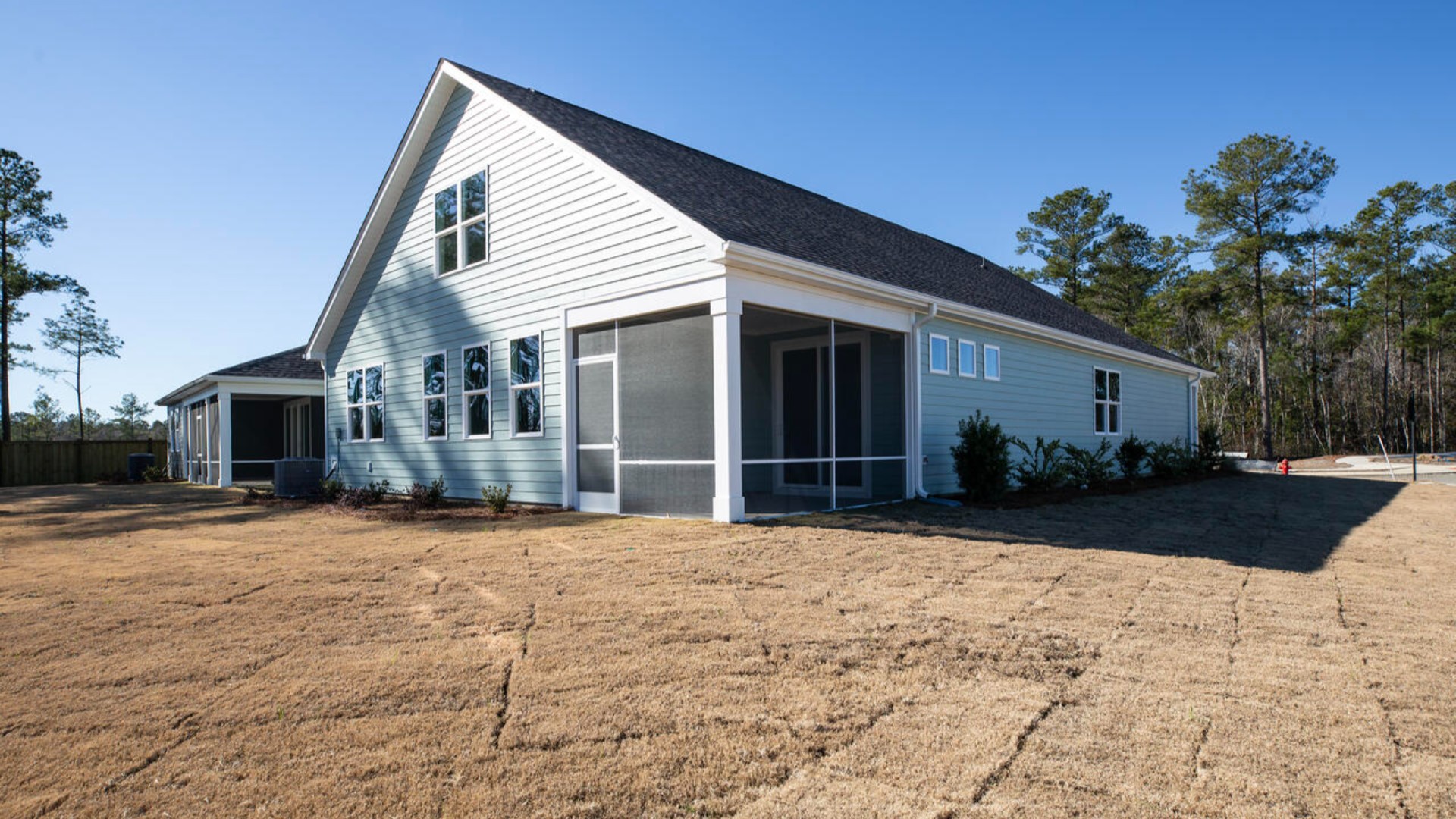 The primary suite as well as on suite is sure to impress with double vanities and a massive walk-in closet. A large, covered porch perfect for entertaining and enjoying the Carolina evenings.