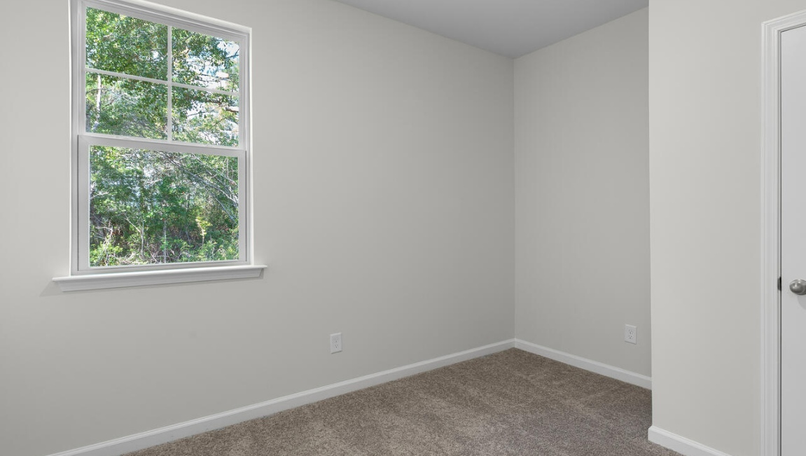 The flexible first floor includes a versatile guest room, office or playroom as well as a full bath across the hall!