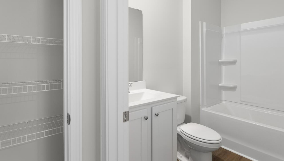 The flexible first floor includes a versatile guest room, office or playroom as well as a full bath across the hall!