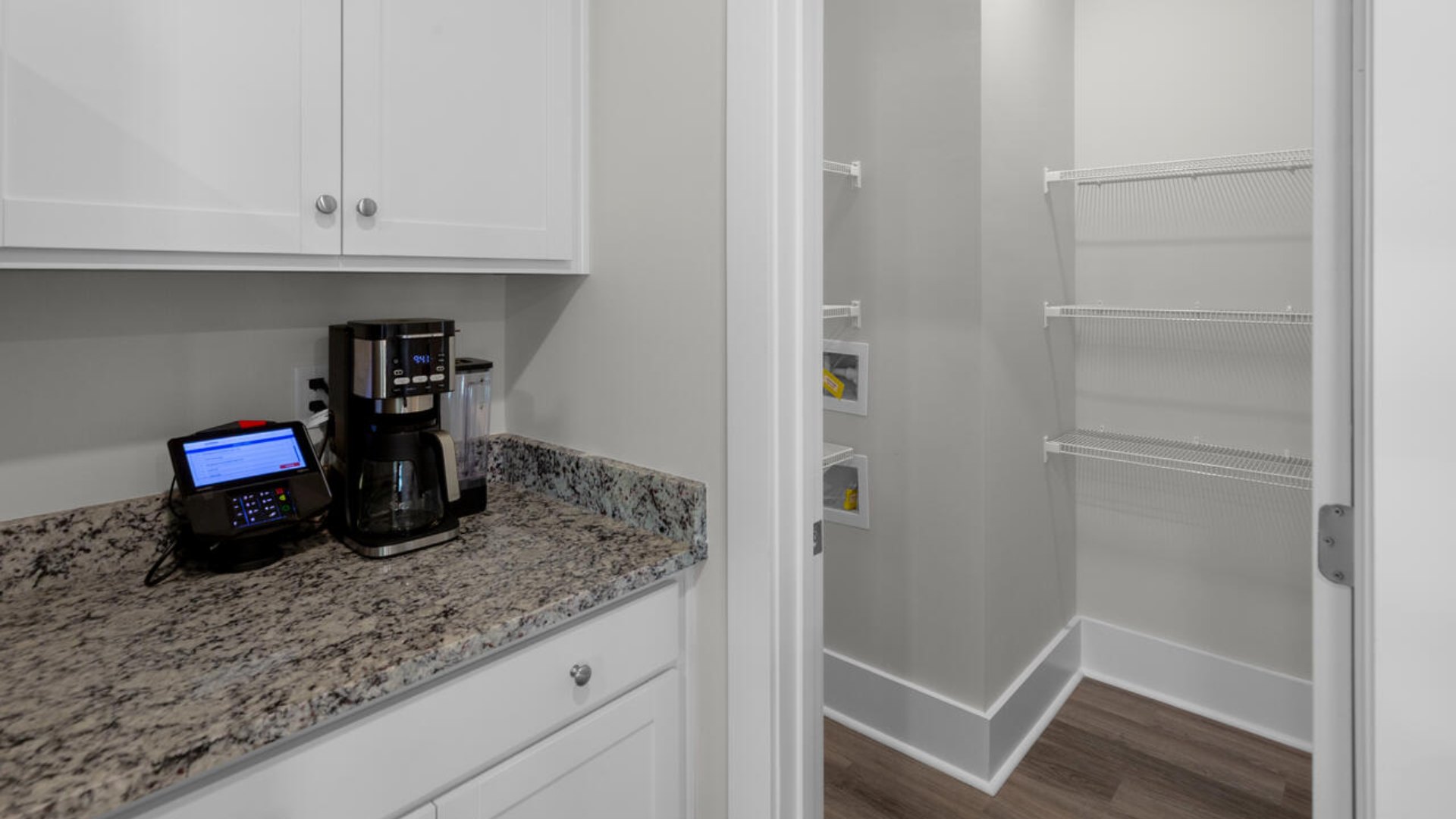 he gourmet kitchen stands out with its elegant granite or granite countertops. tile backsplash and stainless-steel appliance package.